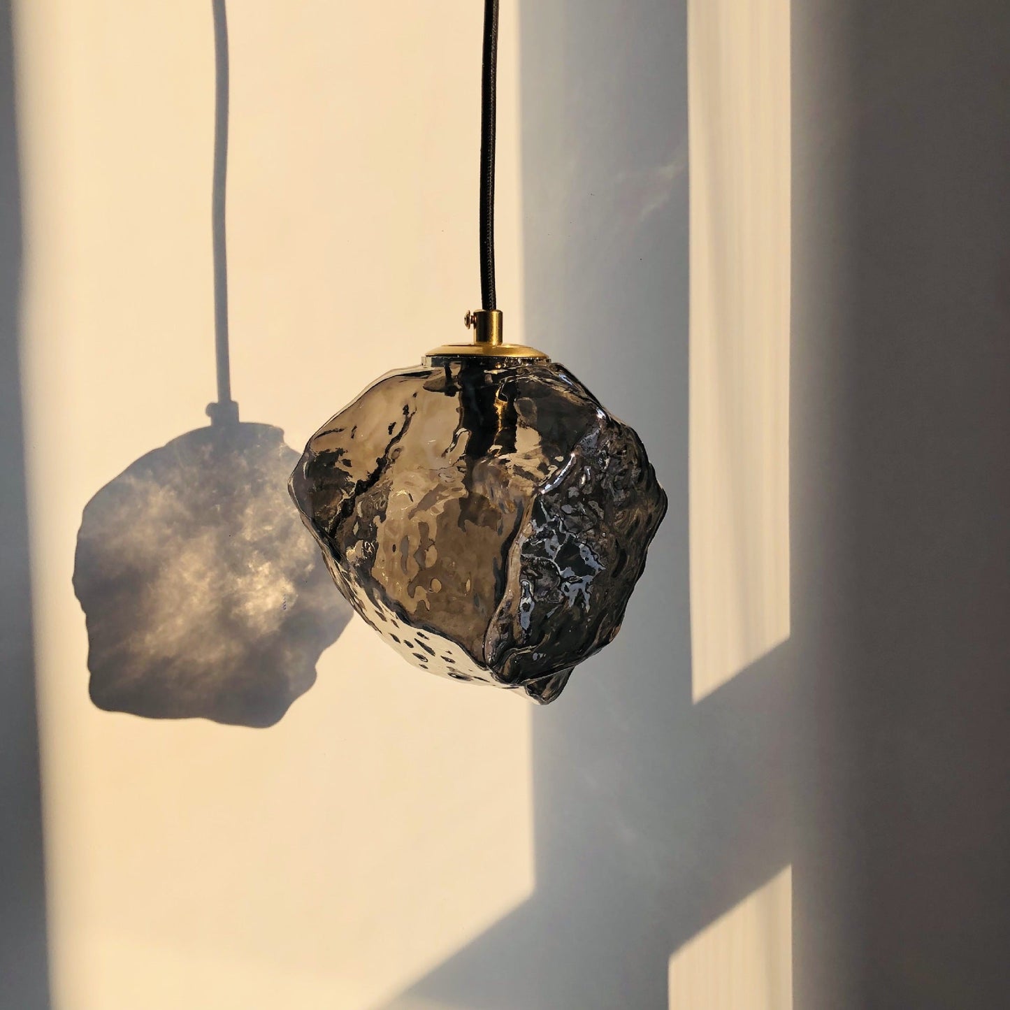 Glaspendel i lava-design